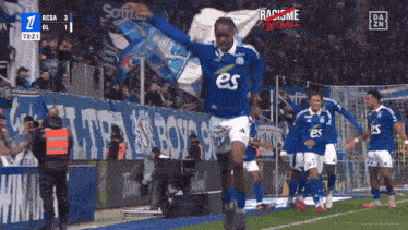 a group of soccer players are celebrating a goal against rcsa