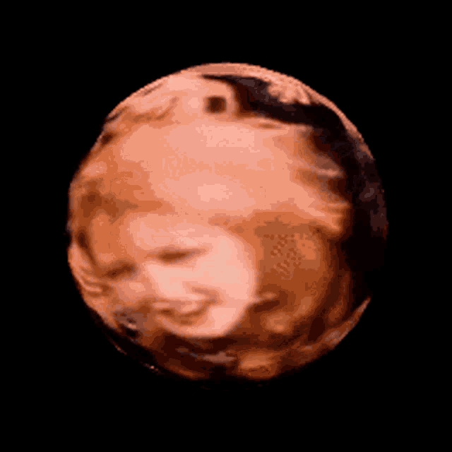 a sphere with a picture of a woman 's face in it