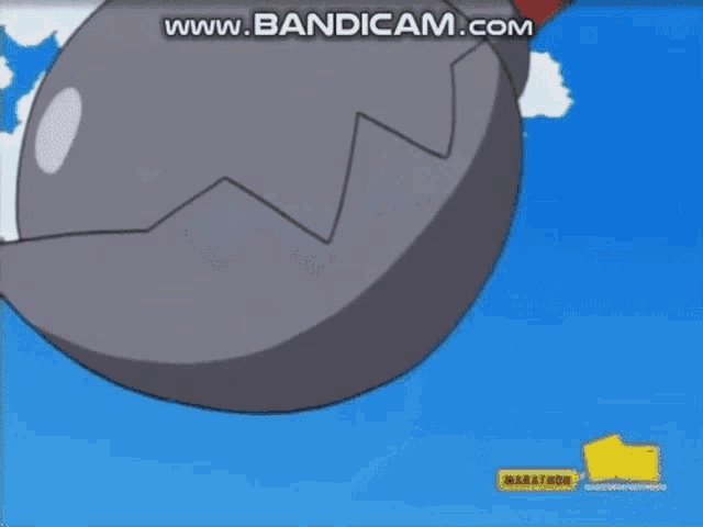 a close up of a cartoon character 's helmet with a blue sky and clouds in the background .