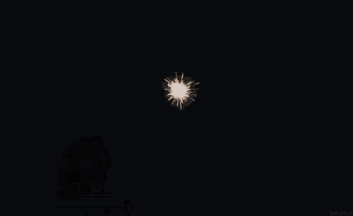 a bunch of fireworks are exploding in the night sky