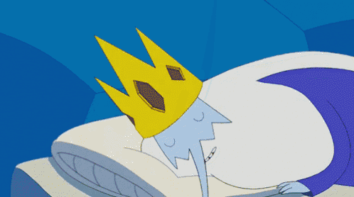 a cartoon character with a crown is laying on a bed