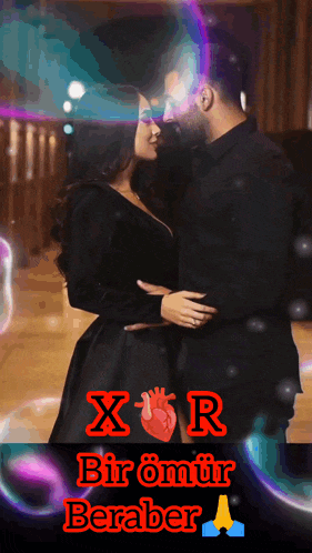 a man and a woman are hugging with the words x r bir omur beraber written below them