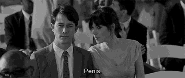 a man and a woman are standing next to each other in a black and white photo . the woman is talking about penis .