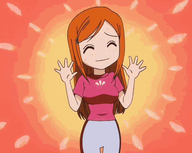 a girl in a pink shirt with a flower on it is smiling
