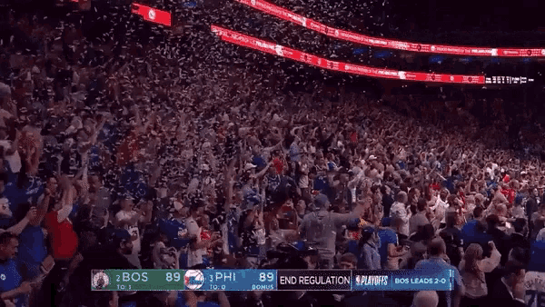 a crowd of people in a stadium with a scoreboard that says end regulation on it