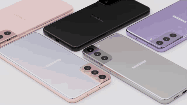 four different colored samsung phones are on a white surface