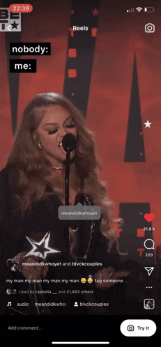 a woman singing into a microphone with the words nobody me on the bottom
