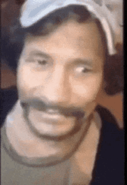 a close up of a man 's face with a bandage around his mouth