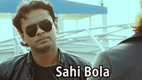 a man wearing sunglasses and a leather jacket has sahi bola written below him