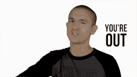 a man is giving a thumbs up sign while wearing a black shirt .
