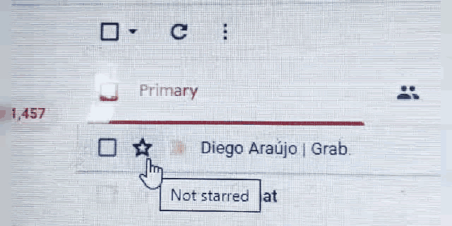 a computer screen with a hand pointing at a not starred at button