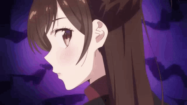 a close up of a girl 's face with purple background .