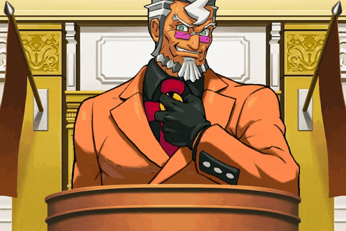 a man in an orange suit and tie is standing at a podium