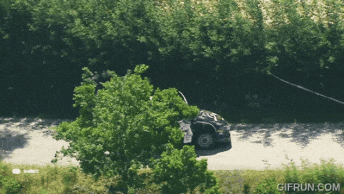 a gif from gifrun.com shows a car on a road