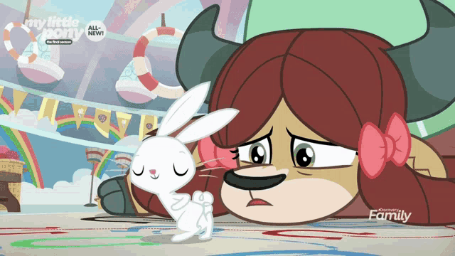 a cartoon of a girl with horns and a white rabbit with the words my little pony all new on the bottom