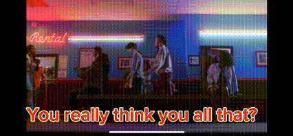 a group of people are standing in front of a rental counter in a room .
