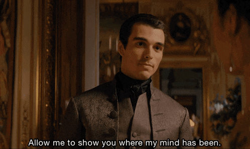 a man in a suit and tie says allow me to show you where my mind has been