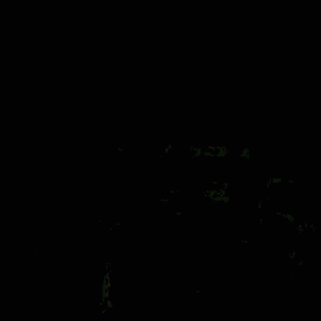 a close up of a colorful background with a green and red glowing object in the middle .
