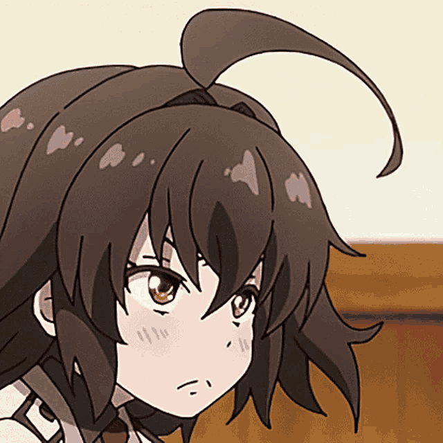a close up of a girl 's face with a ponytail and red eyes