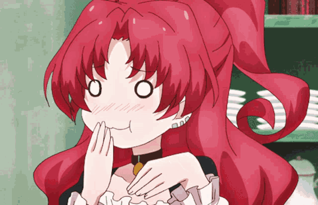 a girl with red hair is making a face with her hands