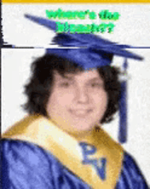 a person wearing a graduation cap and gown with the letter p on it .