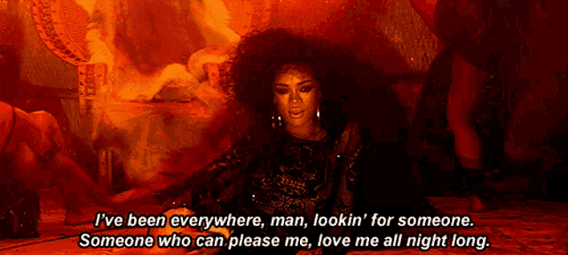 a woman with curly hair is laying on the ground with the words i 've been everywhere man lookin for someone