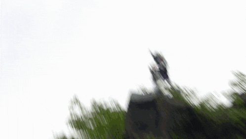 a statue on top of a rock with a purple lightning bolt coming out of it