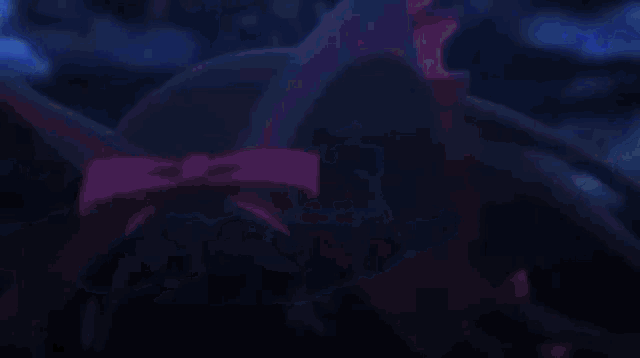 a close up of a purple background with a reflection of a person in it .
