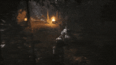 a dark cave with stairs and a few lights