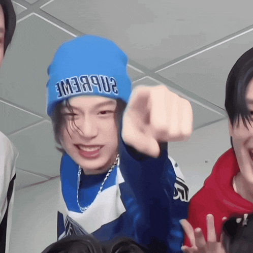 a person wearing a blue beanie that says emea9u2 on it