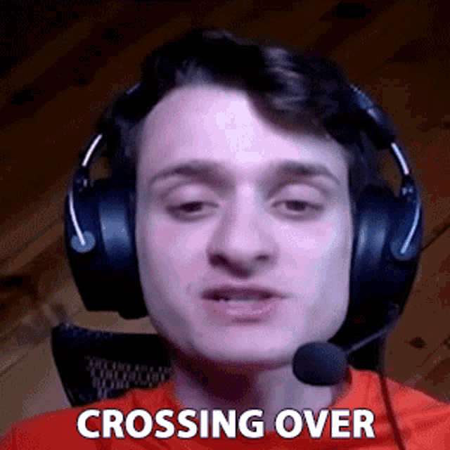 a man wearing headphones and a microphone with the words crossing over above him