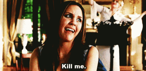 a woman is laughing and saying kill me while another woman stands in the background .