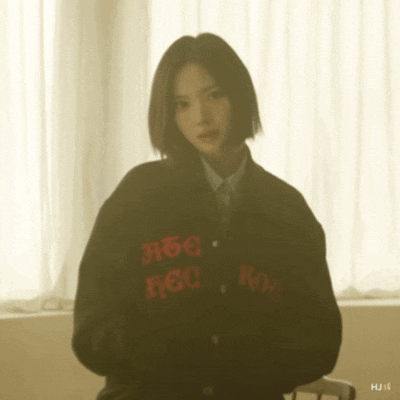 a woman wearing a jacket that says rec on the back