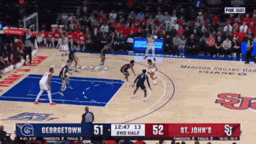 a basketball game between st. john 's and georgetown