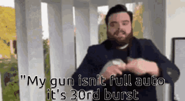 a man with a beard is talking about his gun