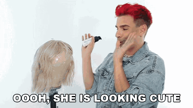 a man with red hair is looking at a mannequin with the words oooh she is looking cute on the bottom