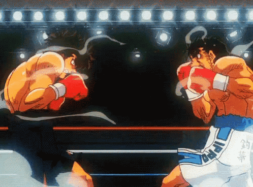 two boxers are fighting in a ring with one wearing shorts that say " ippo "