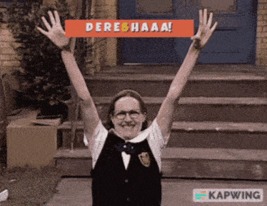 a woman with her arms in the air holding a sign that says dere haaa