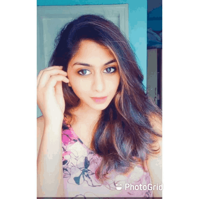 a photo of a woman with photogrid written on the bottom right