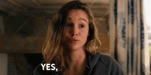a woman is making a funny face and says yes .