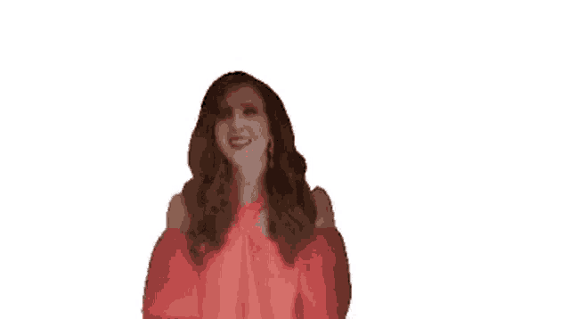a woman in a red dress is holding her arms up in the air .