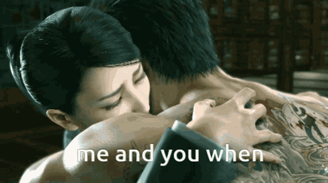 a woman kissing a man 's back with the words me and you when below her