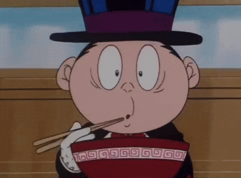 a cartoon character in a top hat is eating a bowl of food with chopsticks .