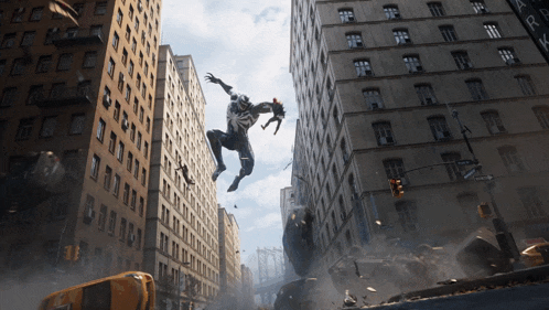 a man is jumping in the air in front of a building with a sign that says ' a ' on it