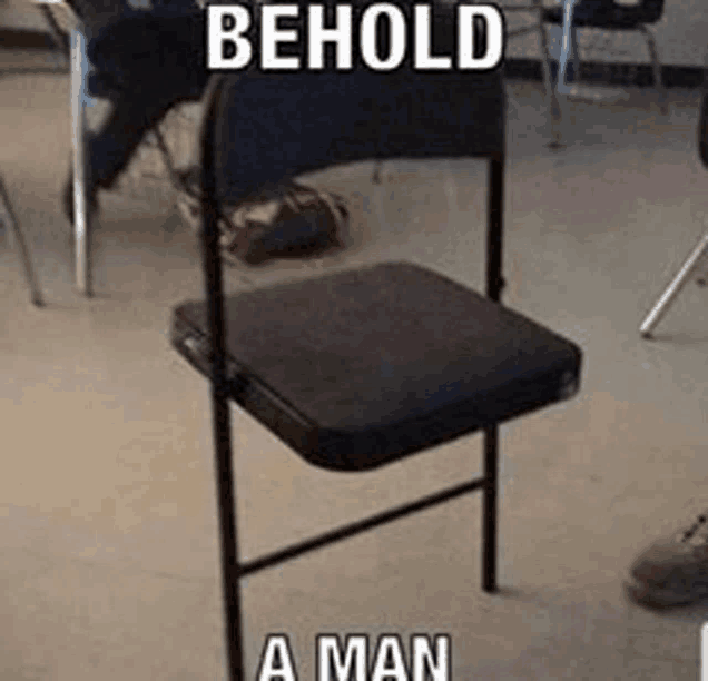 a chair in a classroom with a meme that says behold a man .