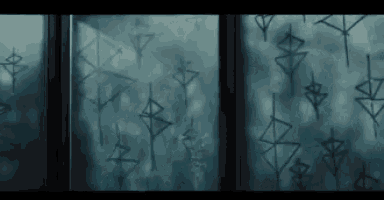 a window with a lot of drawings on it .