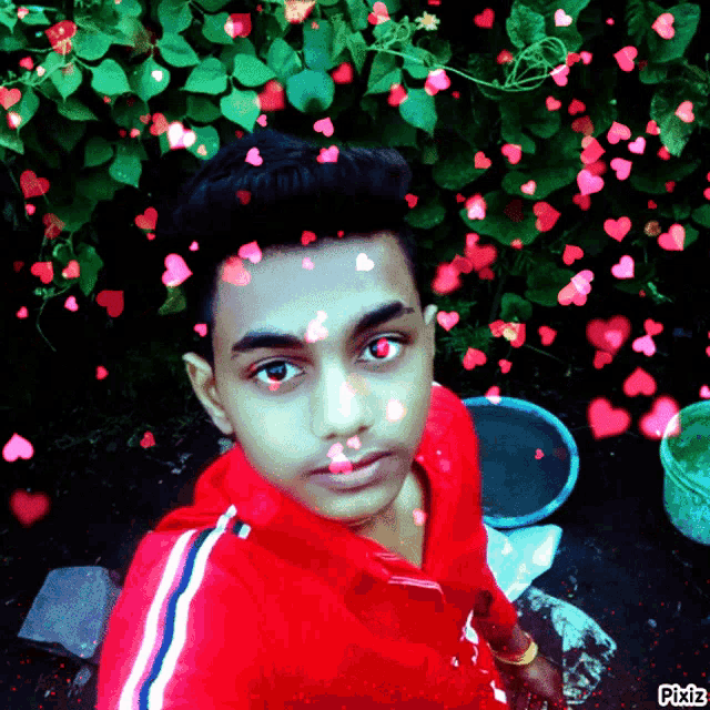 a boy in a red shirt with hearts around his face