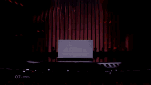 a stage with a white box on it that says ' 07 ' on the bottom