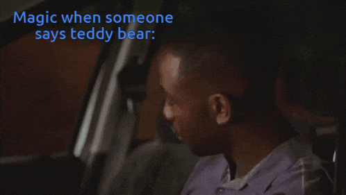 a man sitting in a car with the words magic when someone says teddy bear above him