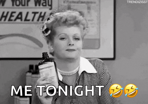 a woman is holding a bottle of medicine and says me tonight